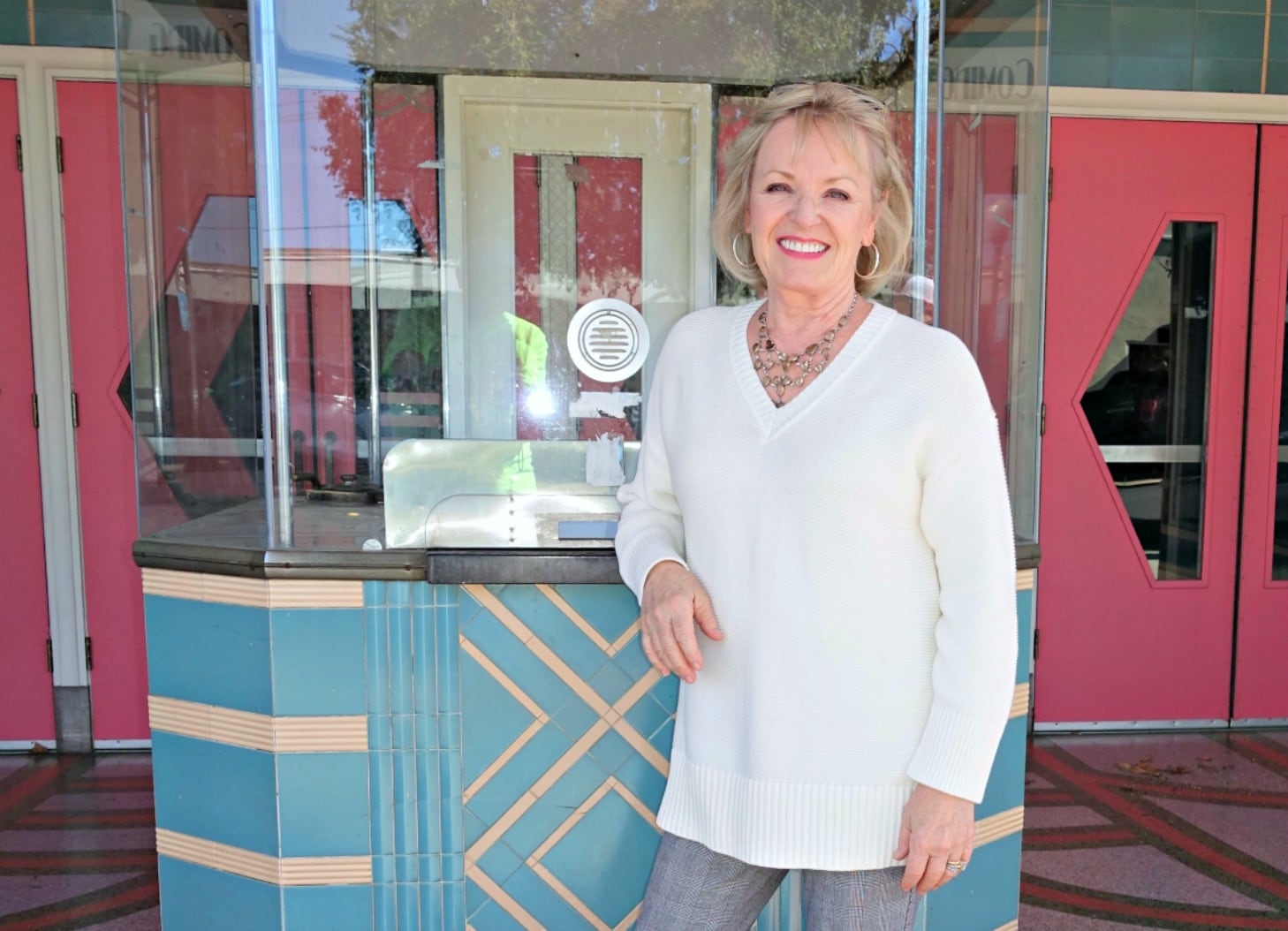 Jennifer of A Well Styled Life wearing ivory tunic
