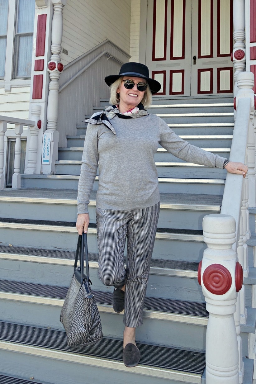 Jennifer Connolly wearing gray head to toe with black fedora