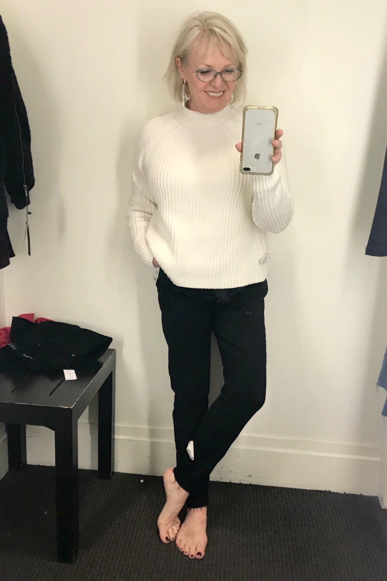 Jennifer Connolly of A Well Styled Life wearing ivory sweater and black skinny jeans from Banana Republic