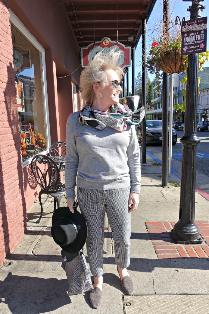 Jennifer Connolly of A Well Styled Life wearing gray silk sweater from Lily Silk