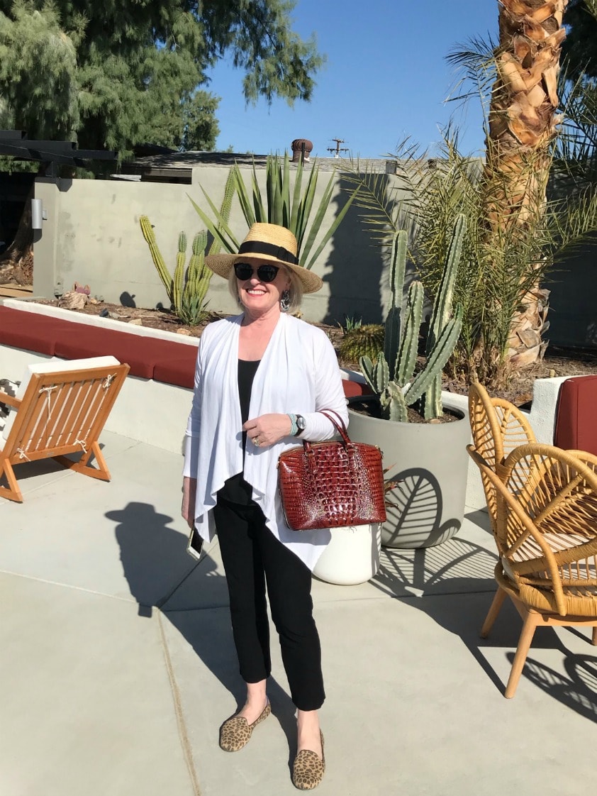 woman in black and white outfit at launter compound
