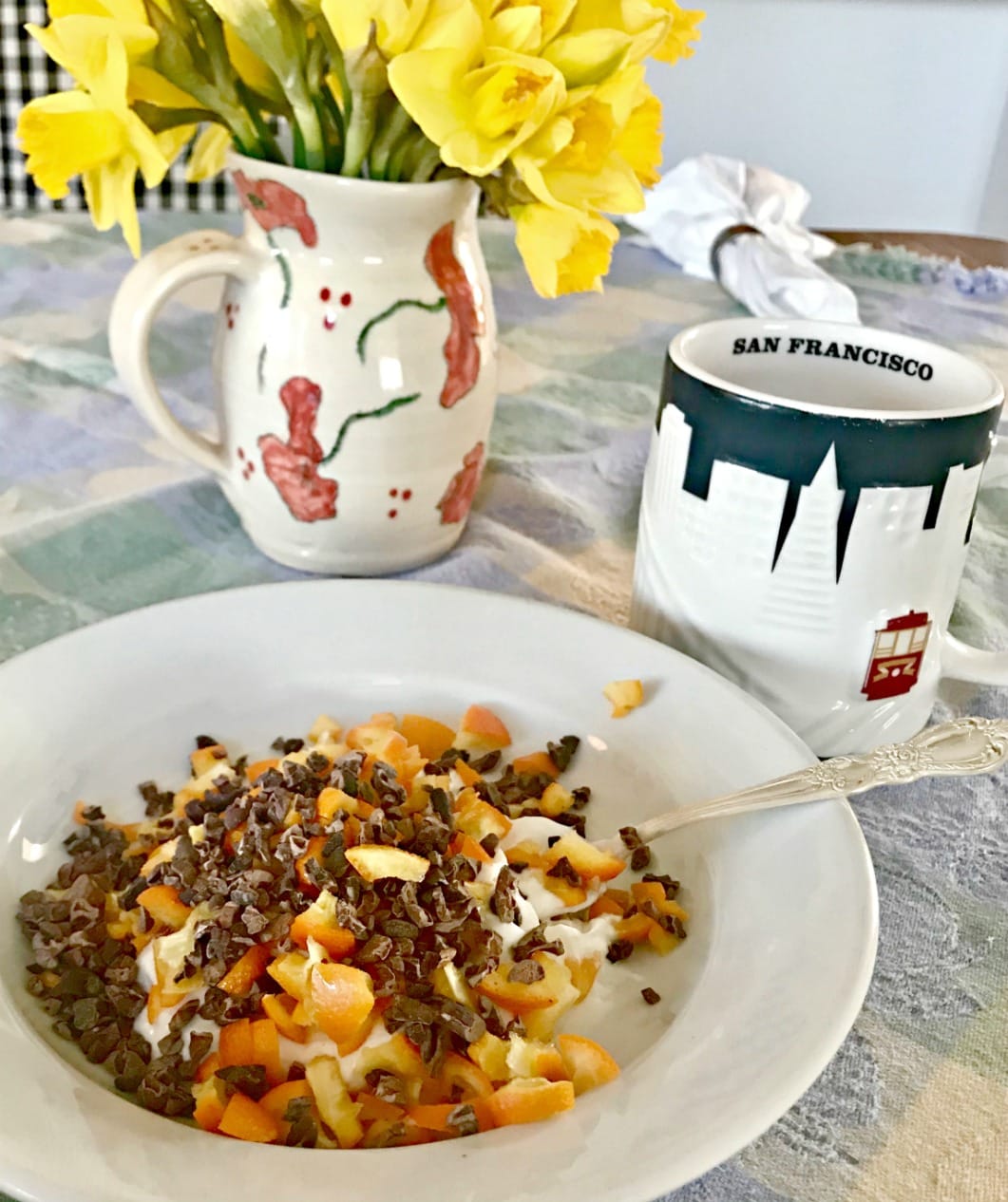 coconut yougurt with sliced kumquats and cocao nibs