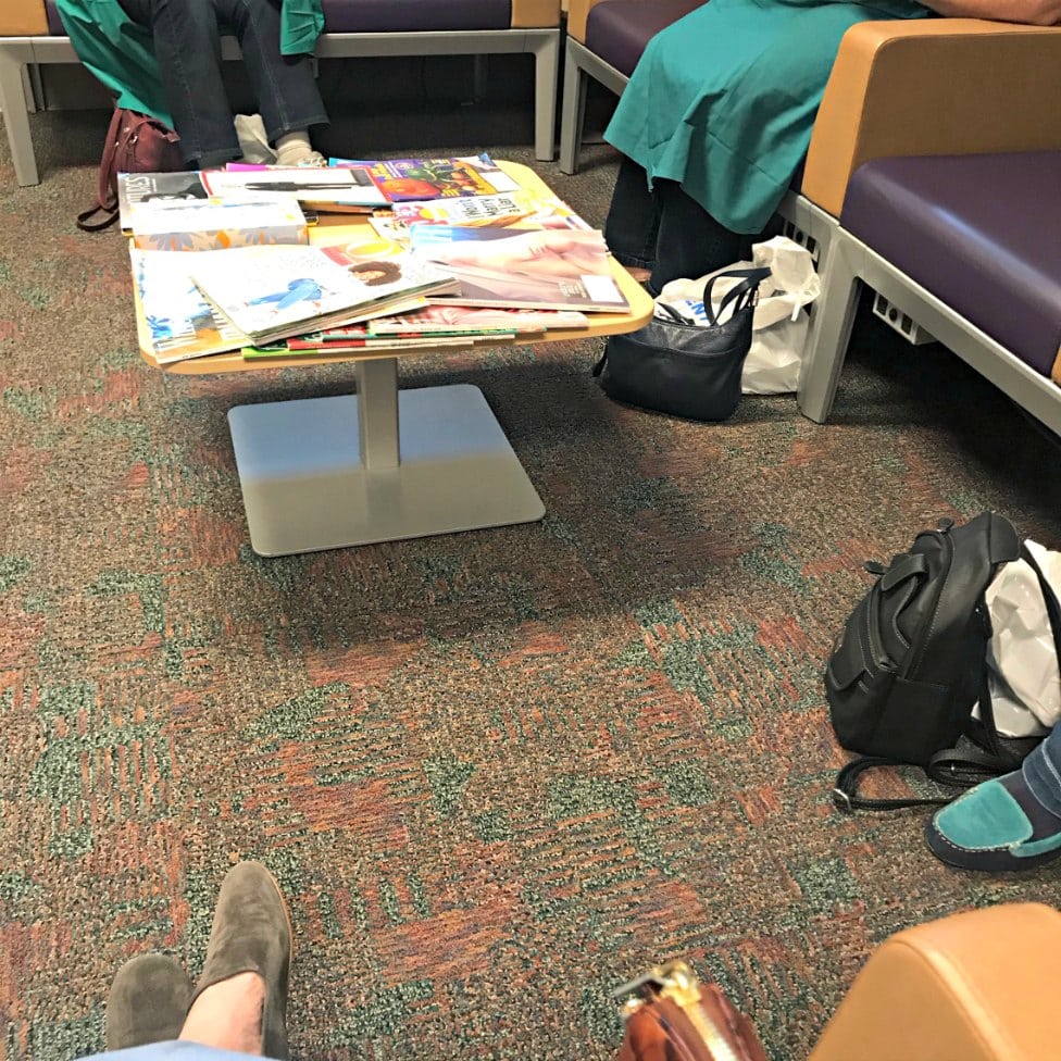 ladies handbags on floor in hospital waiting room