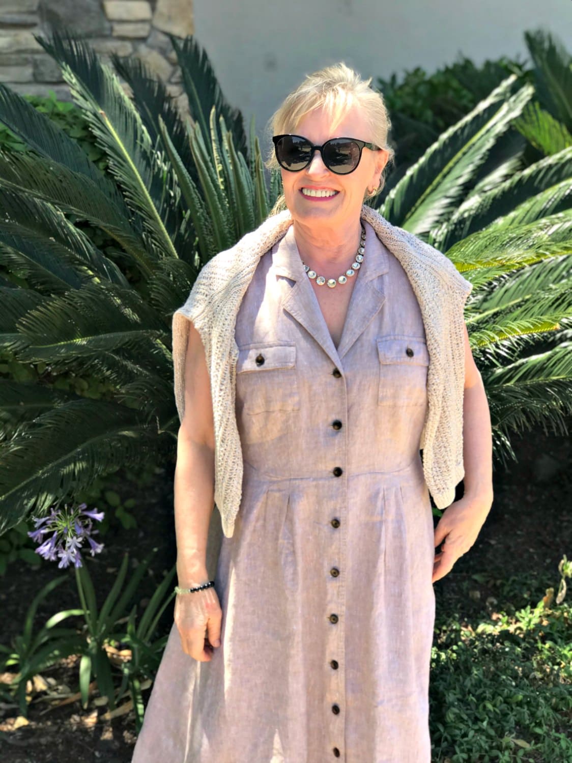 linen sweater over dress on petite over 50 blogger