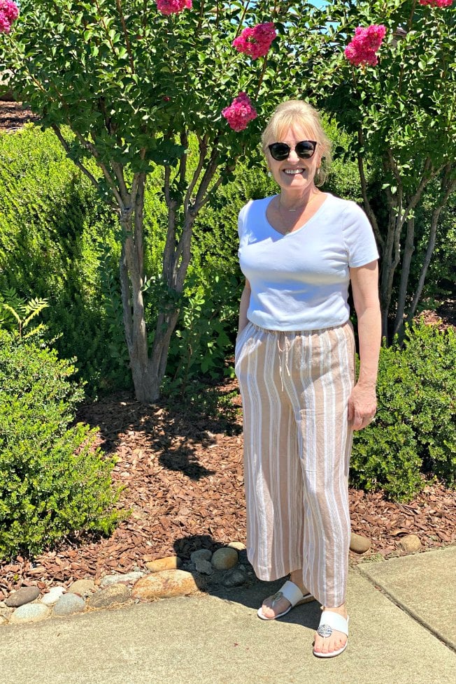 petite over 50 blogger wearing stripe crop pants and white tee