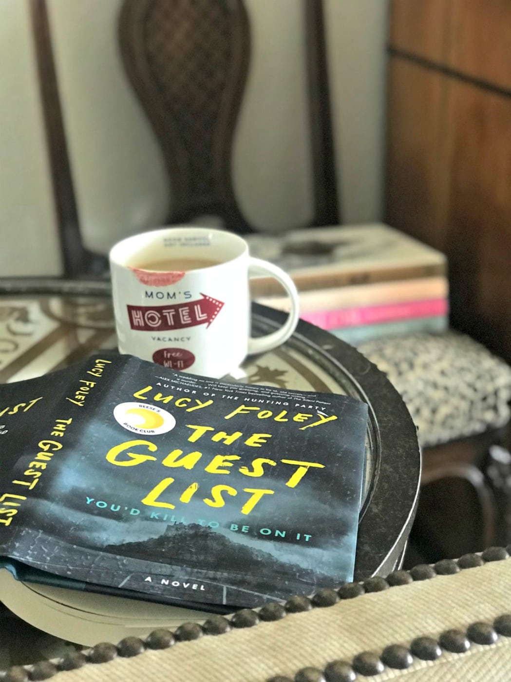 the guest list book and cup of tea
