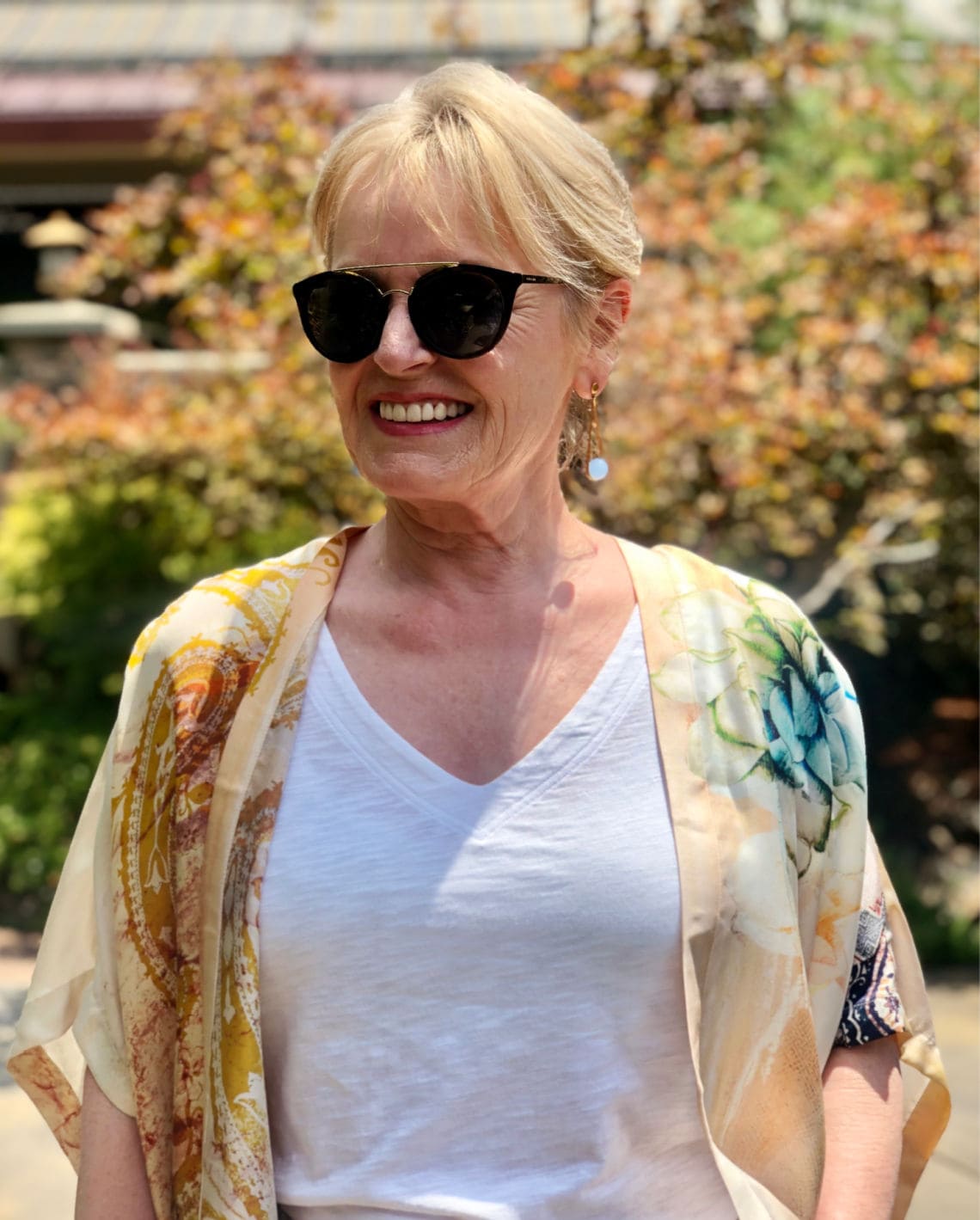 fashion blogger Jennifer Connolly wearing white tank and Ipanema earrings by Dean Davidson