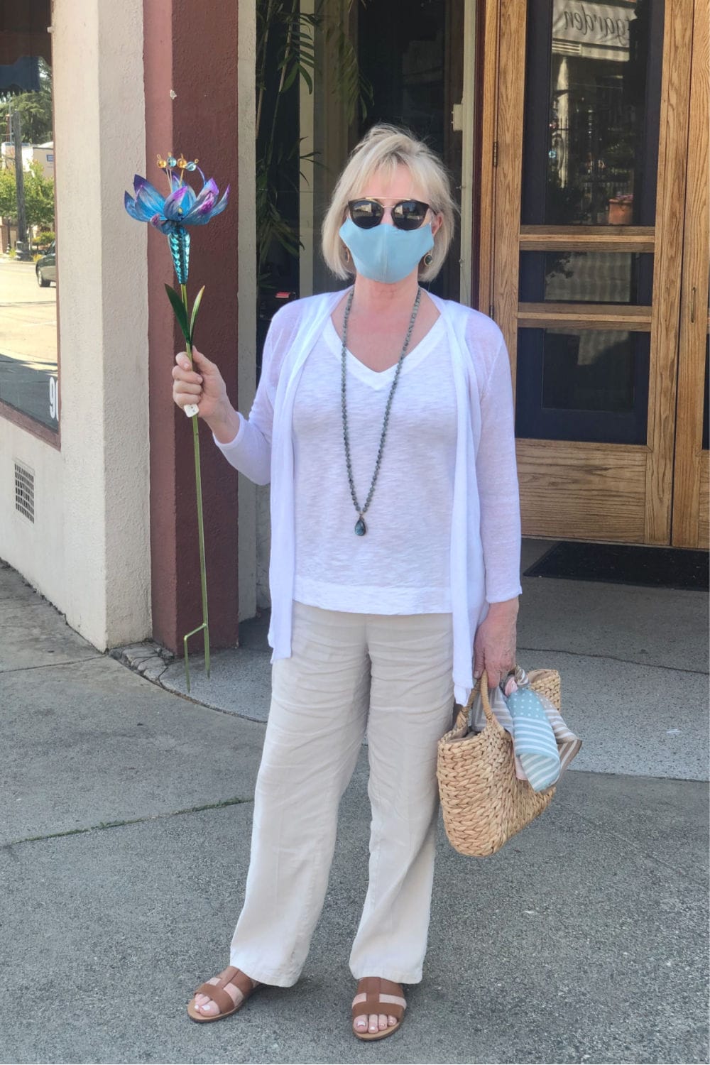 fashion blogger Jennifer Connolly wearing aqua silk face mask