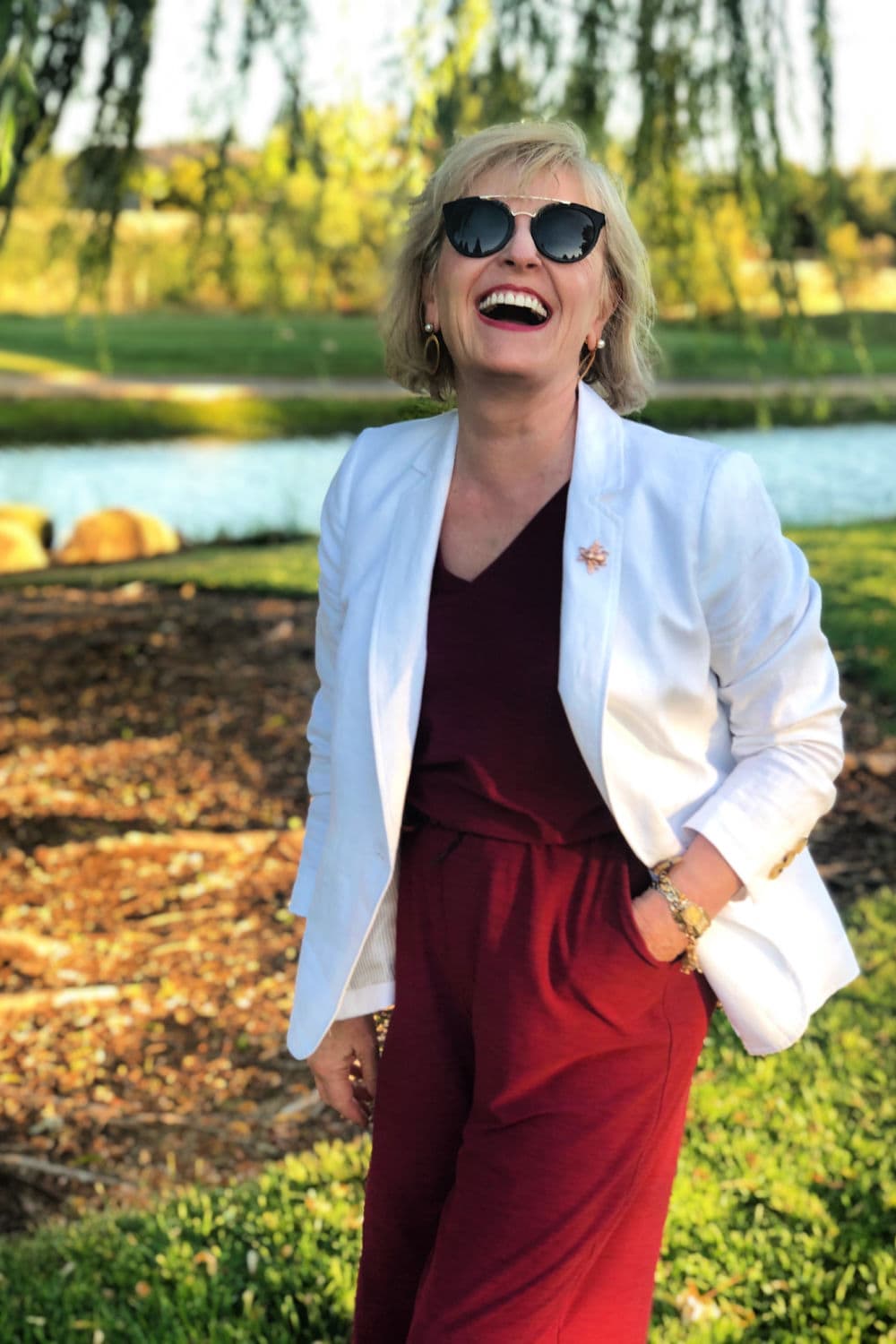 jennifer connolly wearing dean davidson earrings with white linen blazer