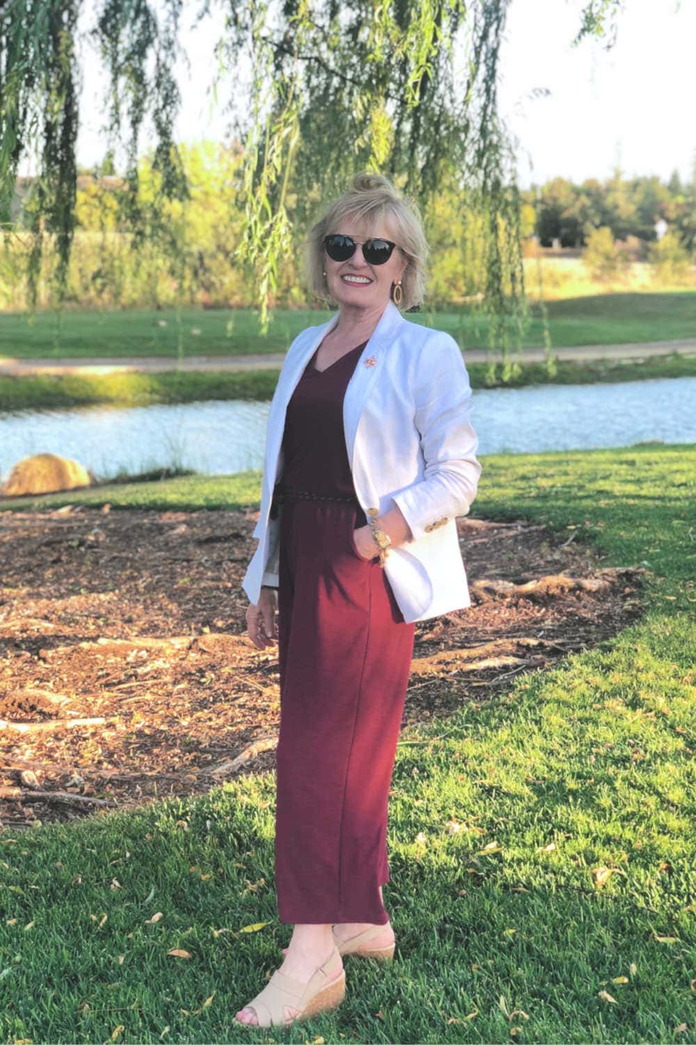 woman wearing blazer and knit jumpsuit