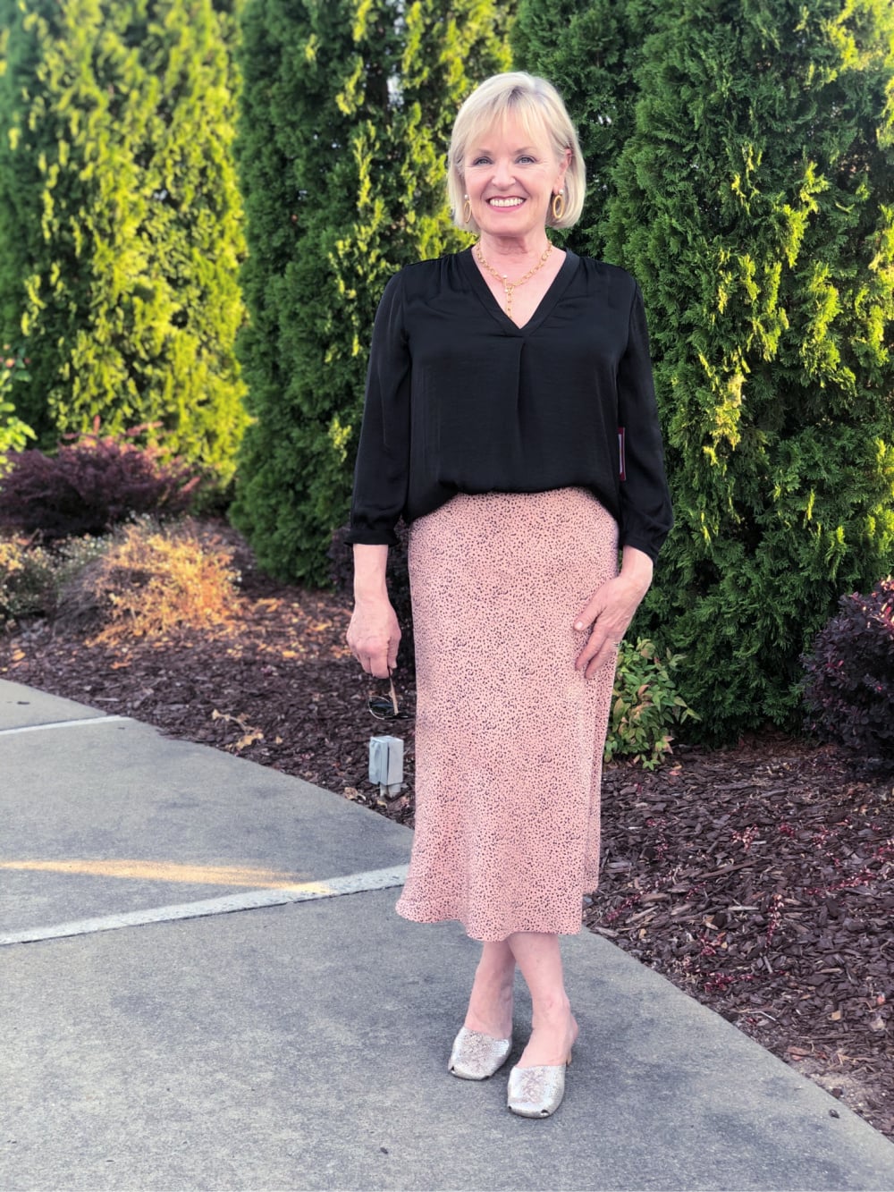 over 50 fashion blogger Jennifer Connolly showing how to style a midi skirt