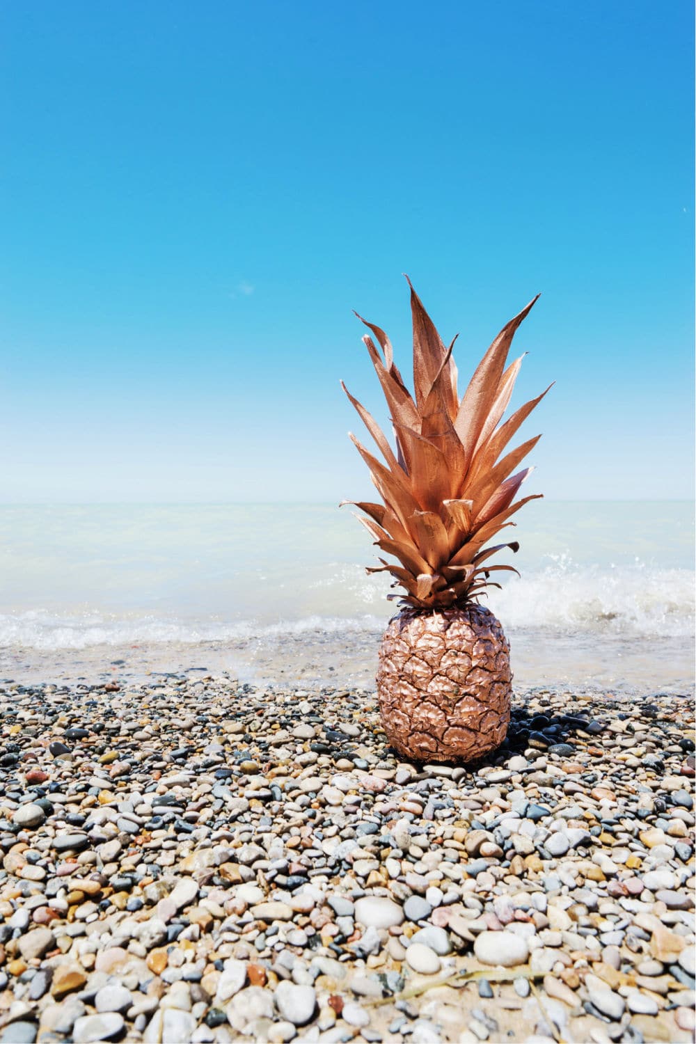 rose gold pinapple on beach