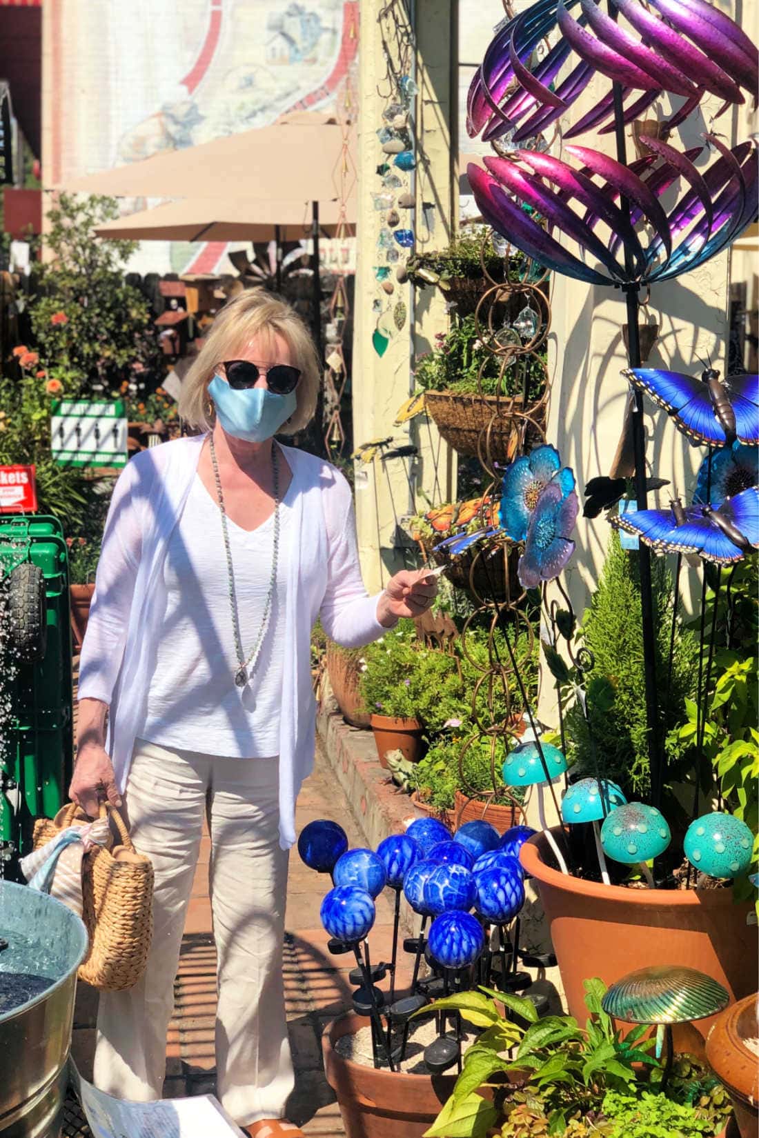 fashion blogger Jennifer Connolly surrounded by Everygreen Wind Spinners