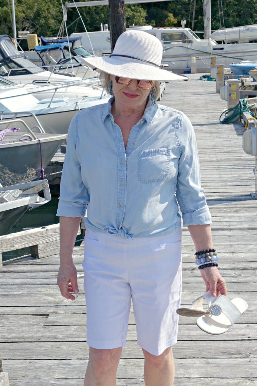 fashion blogger jennifer connolly wearing chambray shirt and white shorts
