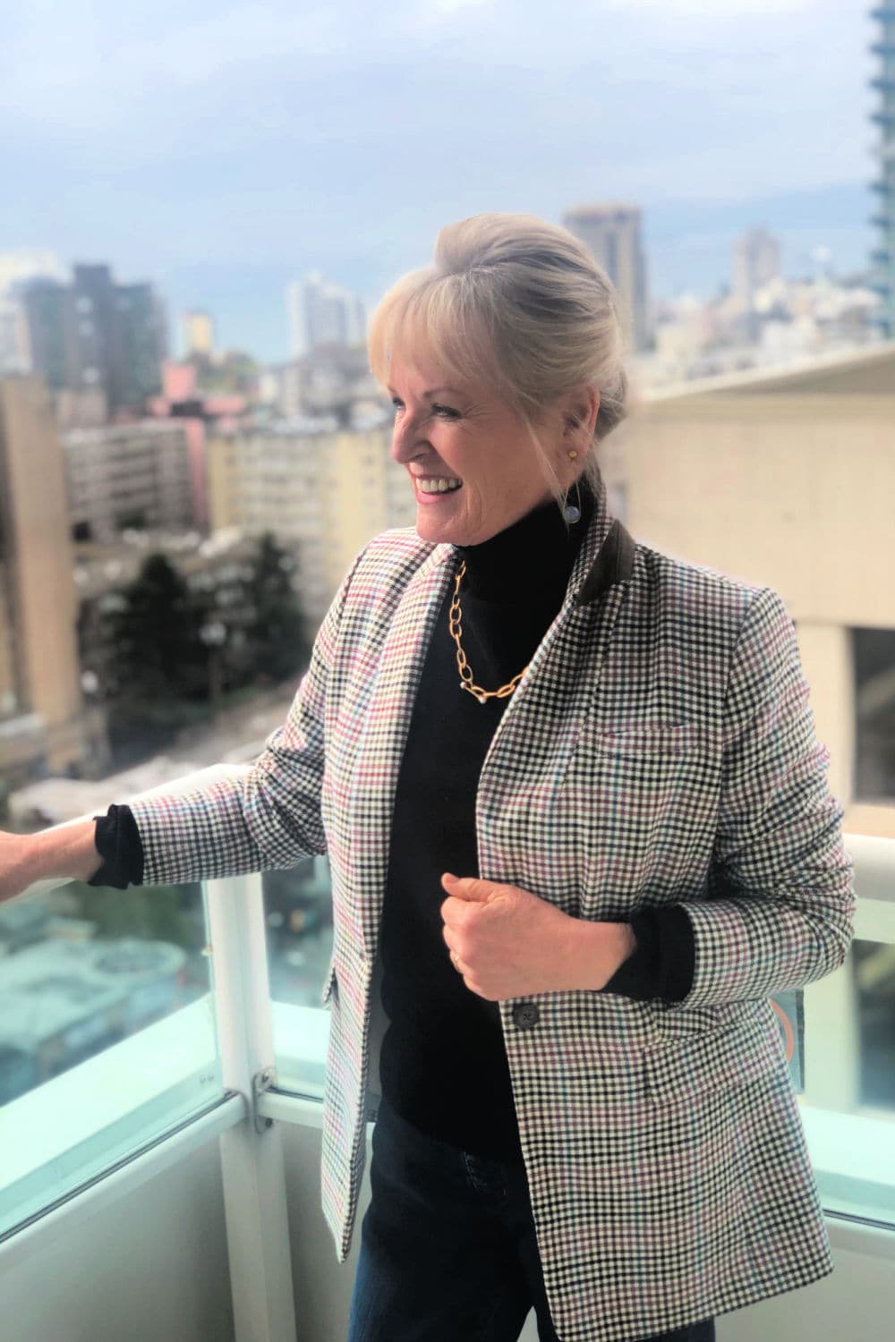 jennifer of a well styled life wearing turtleneck under plaid blazer