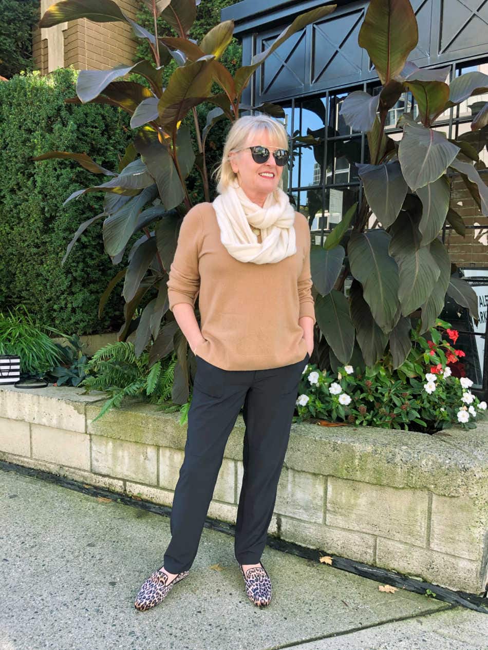 camel sweater, black pants and leopard slipper outfit