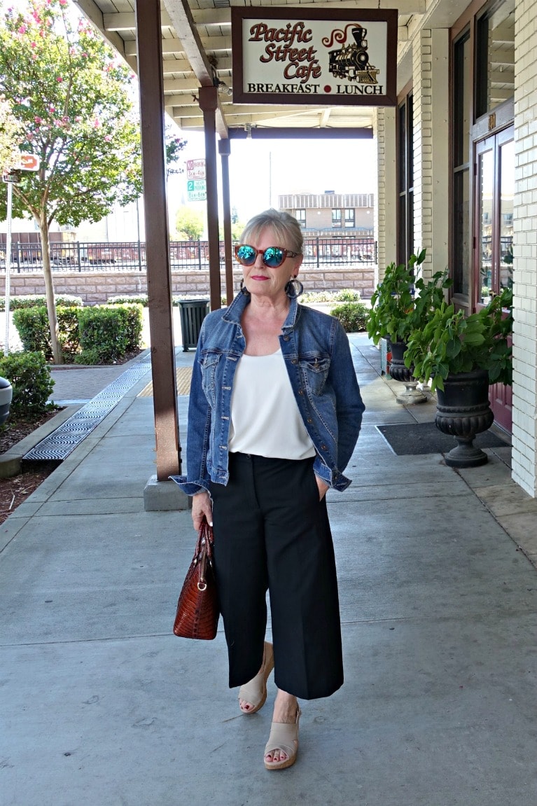 fashion blogger jennifer of A Well Styled Life wearing denim jacket and modern crop pants