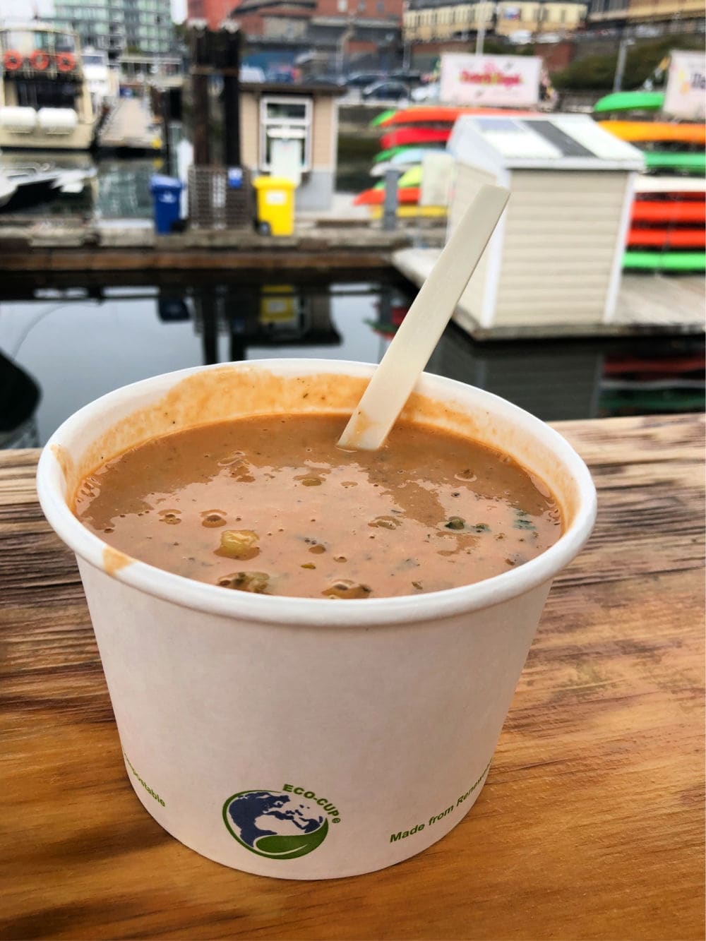 cup of red fish blue fish chowder on dock in victoria