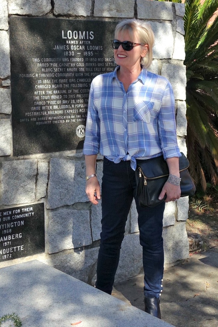 fashion blogger jennifer connolly wearing modern legged jeans and plaid shirt