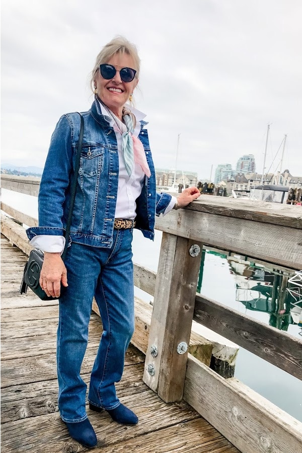 women wearing denim jacket and blue jeans on dock in victoria harbor