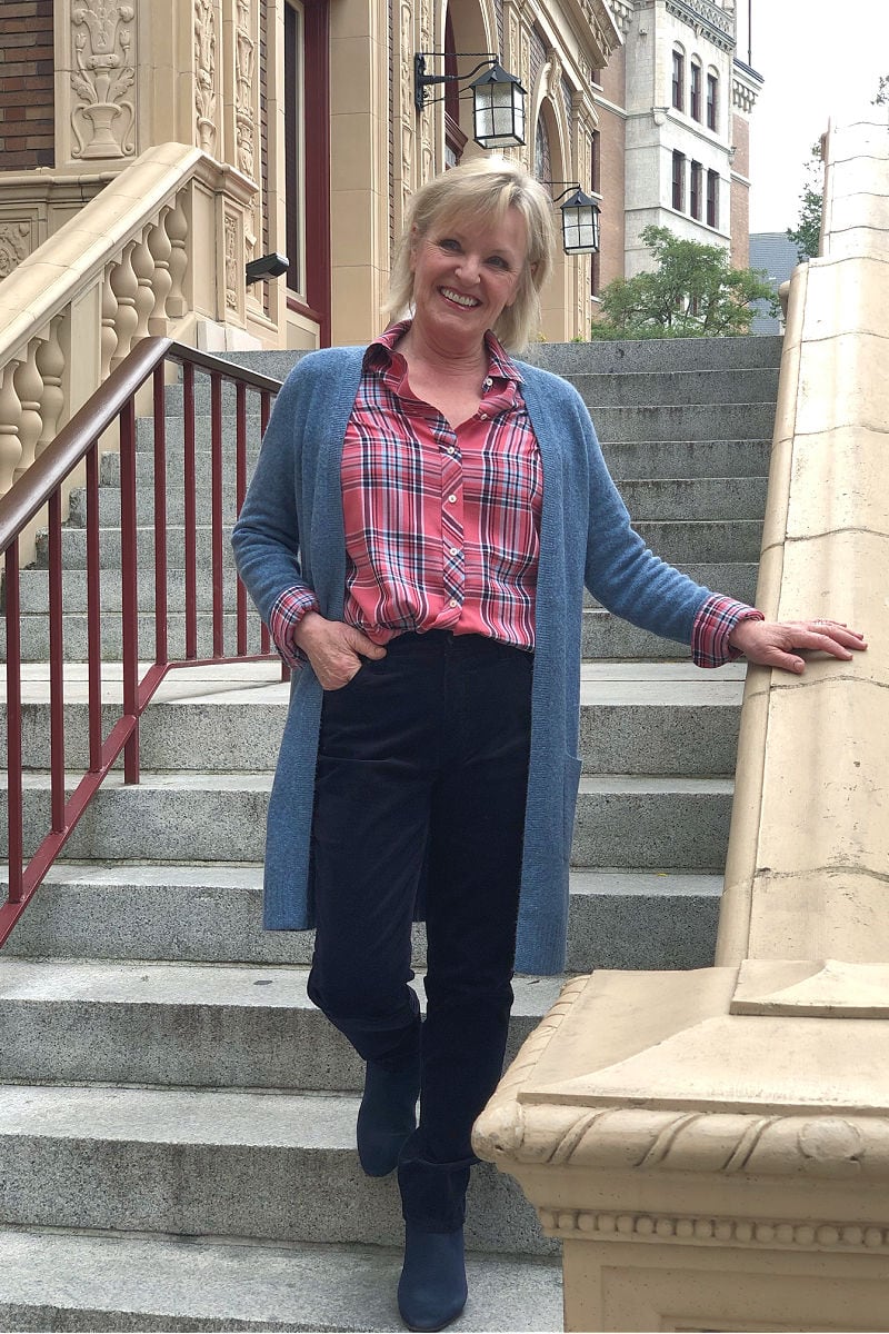 women on staircase wearing talbots sweater and plaid hirt