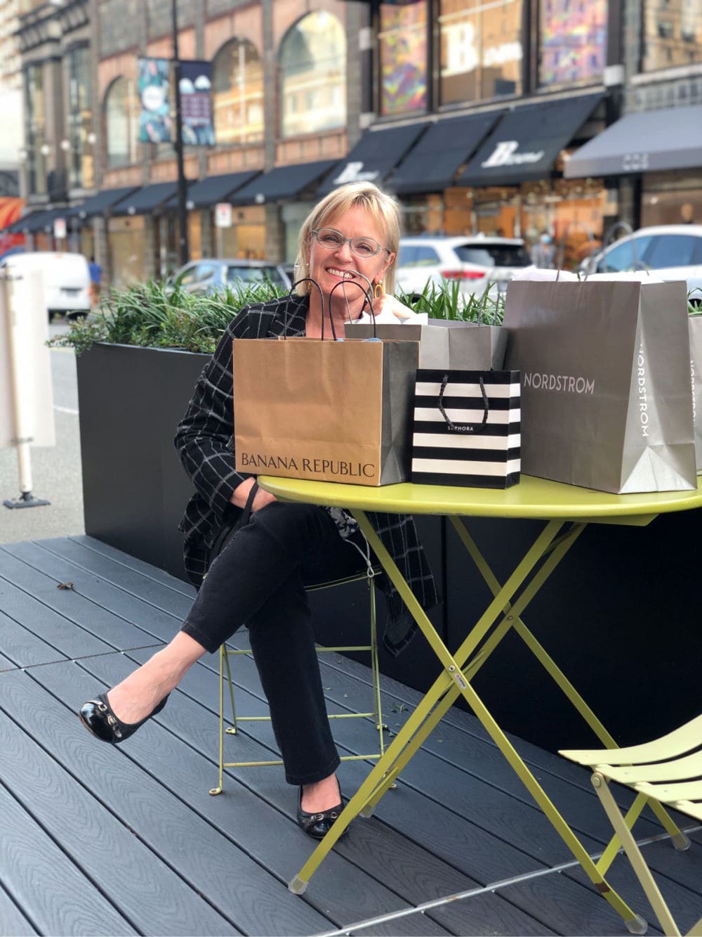 fashion blogger jennifer connolly surrounding by shopping bags