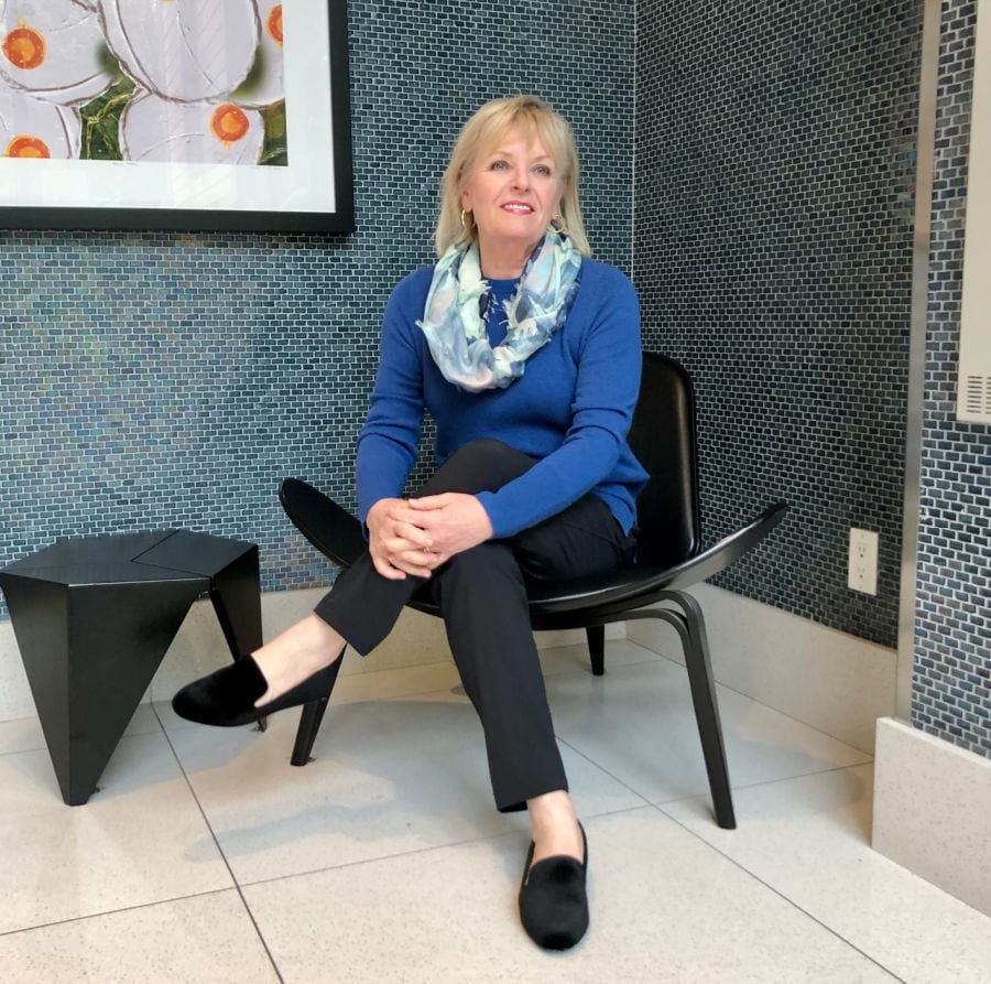 jennifer of a well styled life wearing Nordstrom blue sweater, zella pants and Caslon shoes