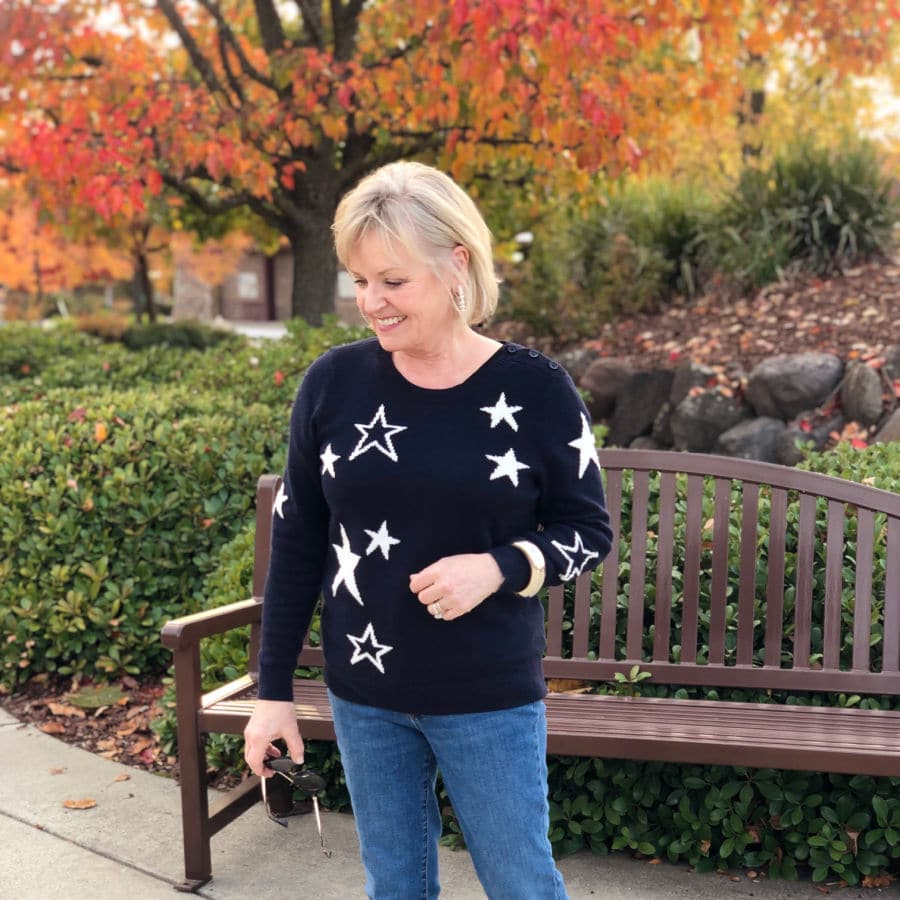 navy star sweater worn by jennifer connolly of a well styled life