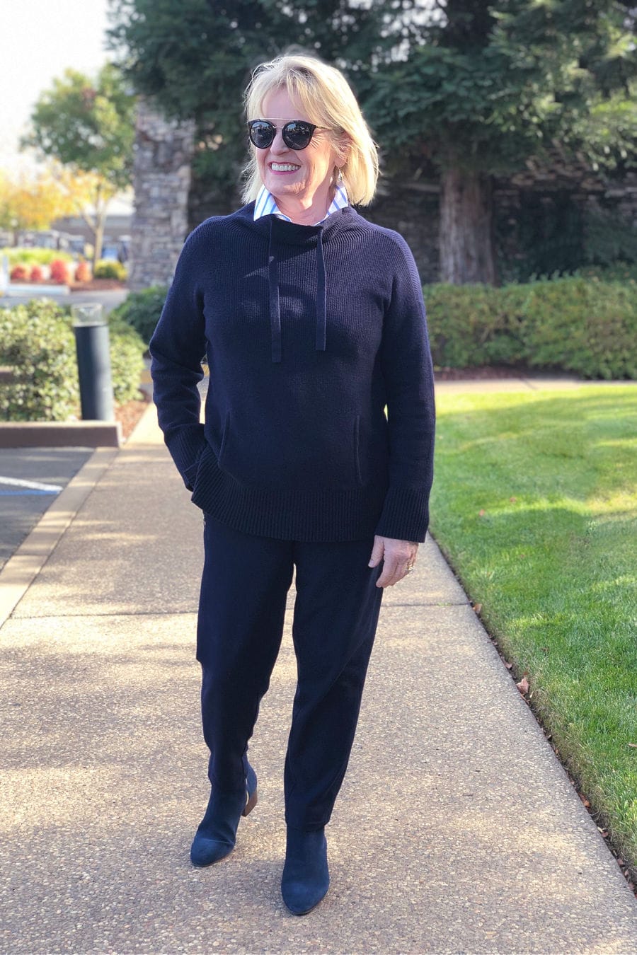 over 50 fashion blogger jennifer connolly wearing navy talbots sweater, pants and boots