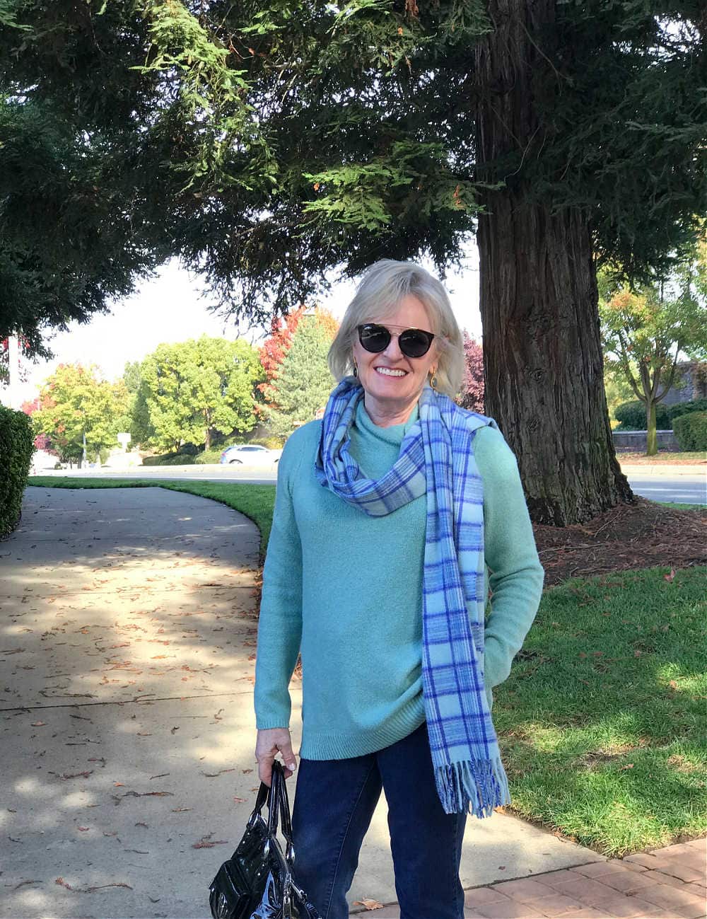 casual fall outfit with bootcut jeans on jennifer of a well styled life