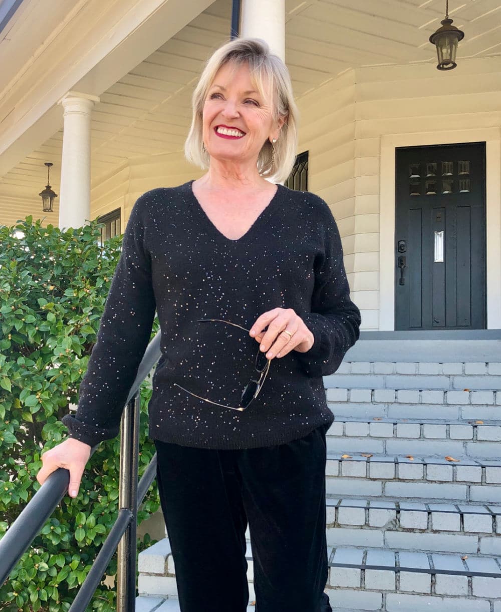 JENNIFER CONNOLLY WEARING SPARKLY SWEATER FROM LOFT ON STAIRWAY