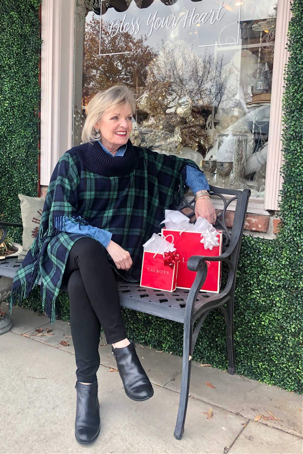 fashion blogger jennifer connolly of a well styled life sitting on bench wearing Talbots ribknit poncho