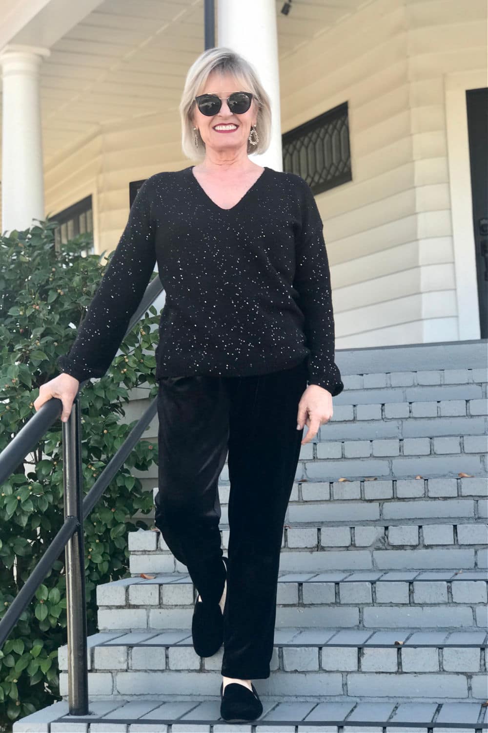 over 50 fashion blogger jennifer connolly styleing birdies loafers with black sweater and velvet pants