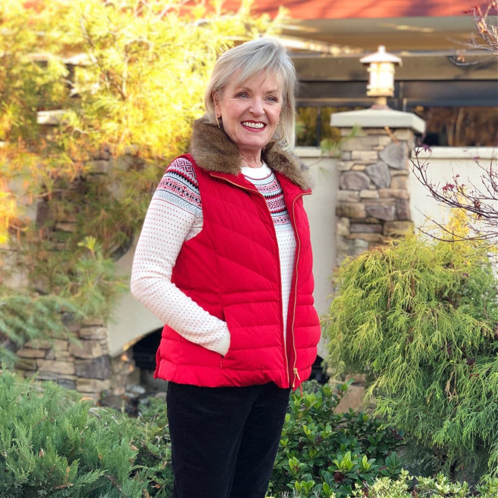 Over 50 fashion blogger jennifer connolly of a well styled life wearign Talbots red puffer vest with fairisle sweater and black cords