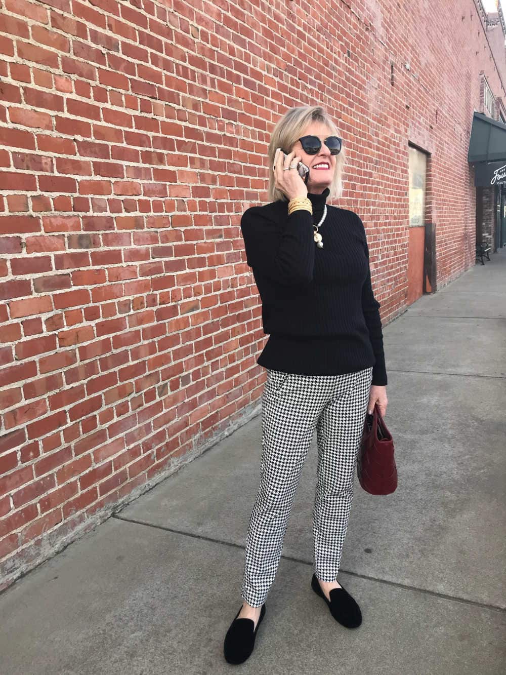 fashion blogger jennifer connolly wearing herringbone pants and turtleneck from chicos