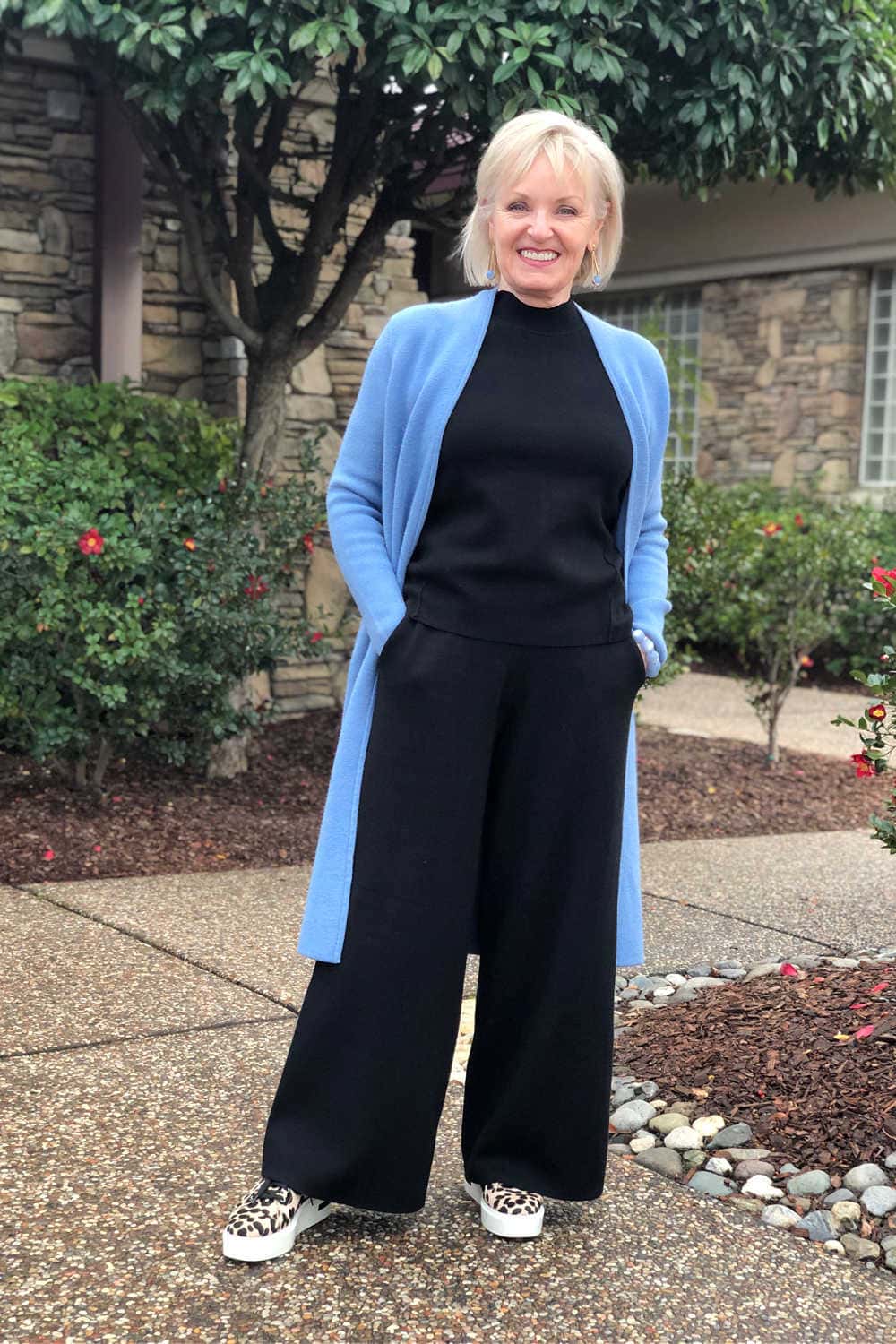 over 50 fashion blogger jennifer connolly wearing coatigan over black pants and top from Banana Republic