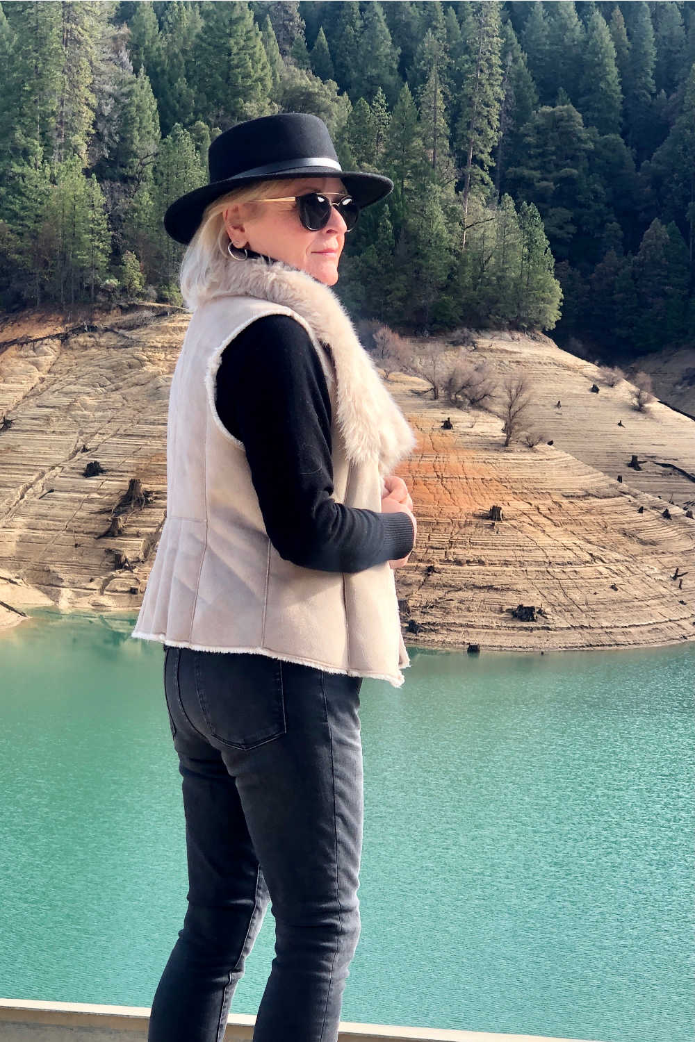 fashion blogger jennifer connolly of a well styled life wearing black hat and nic + zoe faux fur vest