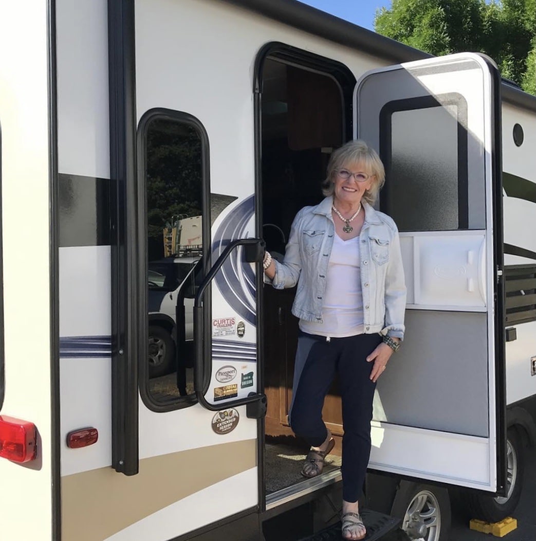 fashion blogger jennifer connolly of a well styled life in doorway of travel trailer