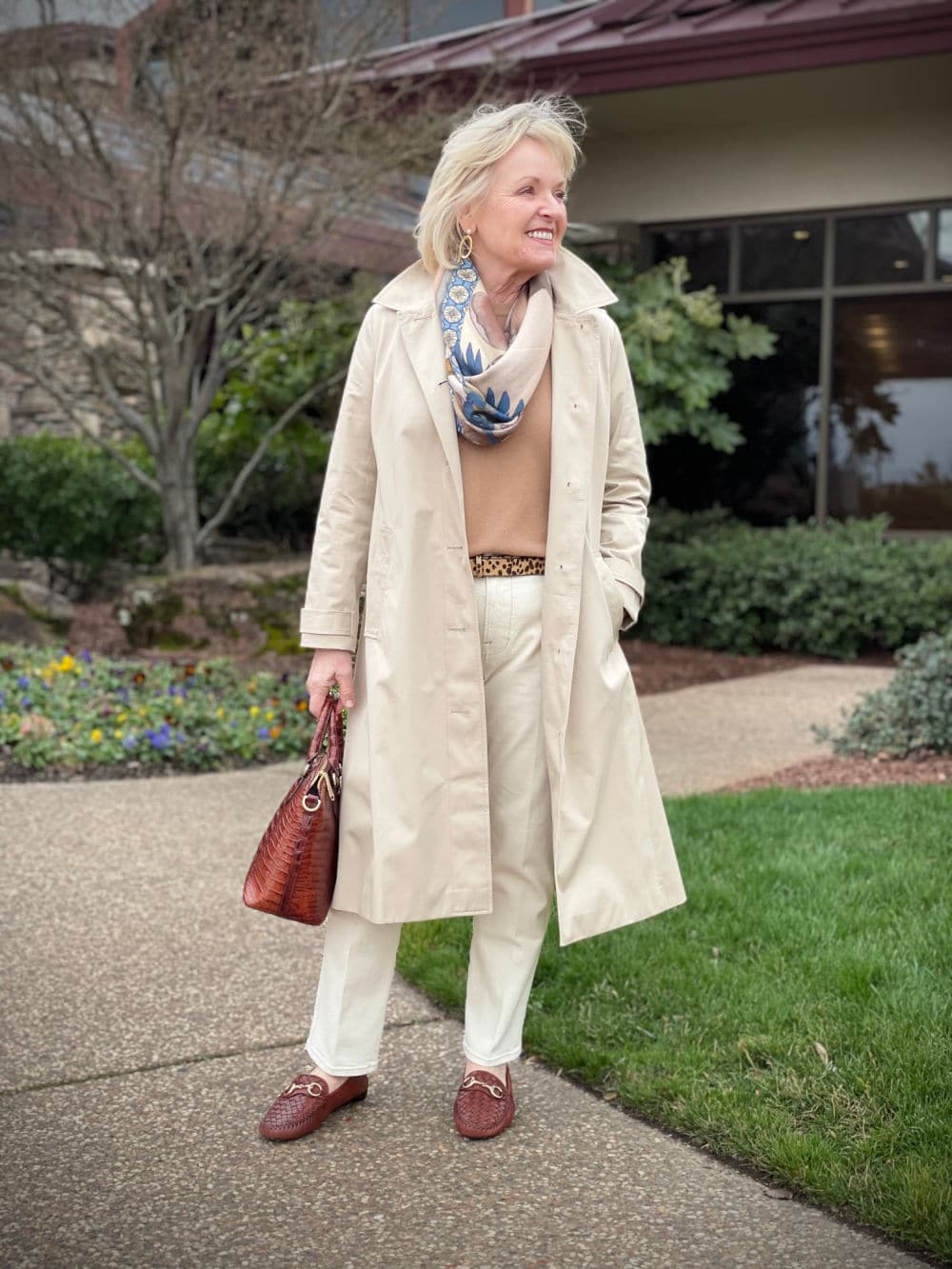 neutral outfit worn under beige raincoat