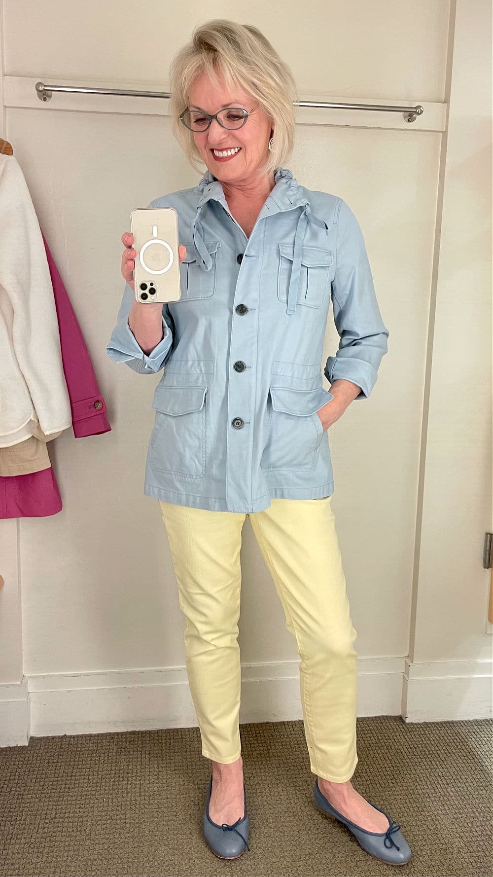 brightly colored yellow jeans and powder blue jacket on jennifer of a well styled life
