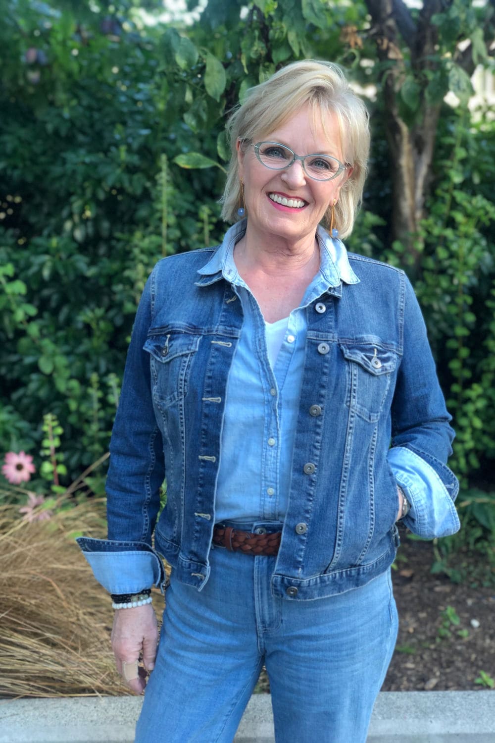 woman wearing blue denim jacket and blue shirt with blue jeans