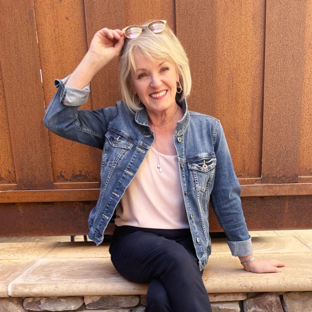 blond woman wearing denim jacket timeless wardrobe essentials