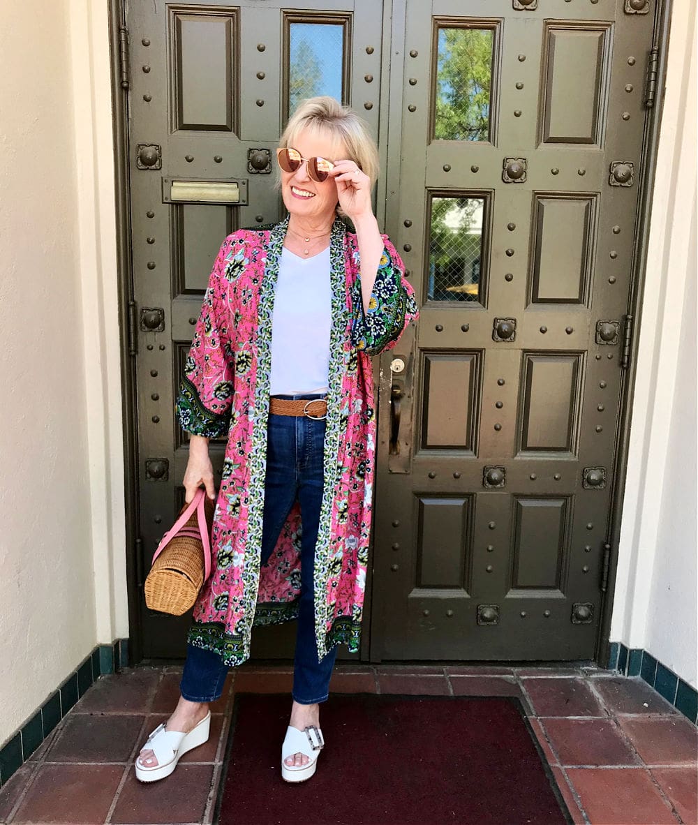 women wearing pink sunglasses and floral kimono