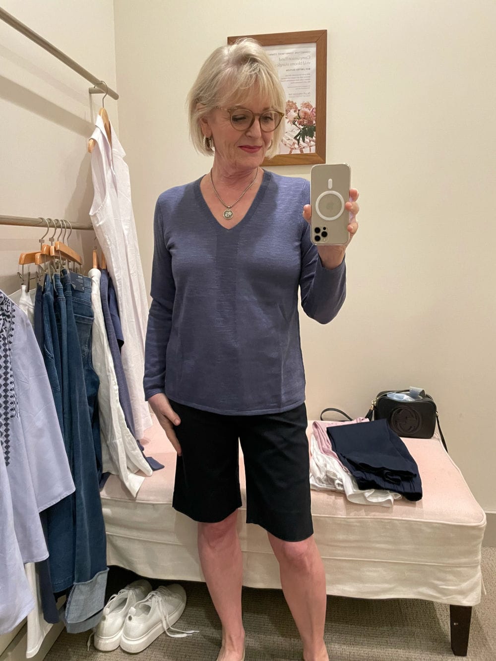 jennifer connolly of a well styled life wearing bermuda shorts and line sweater