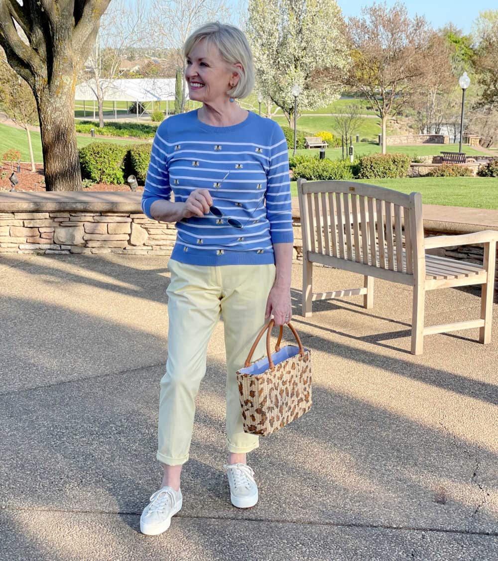 jennifer of a well styled life wearing yellow chinos and blue stripped sweater