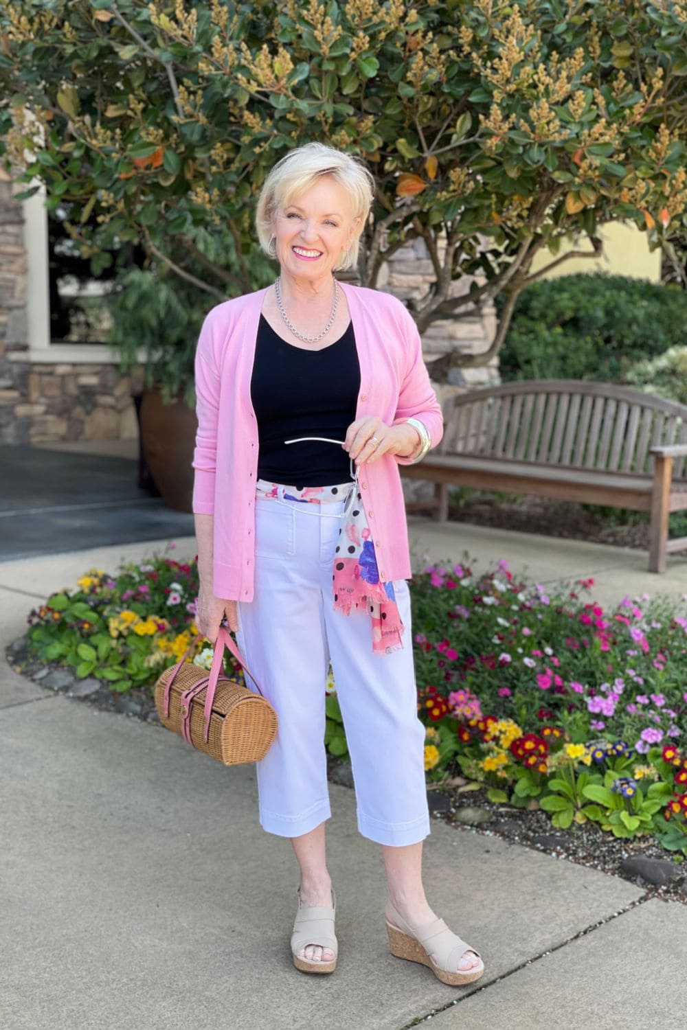 over 50 blogger jennifer connolly wearing cropped chinos and pink sweater