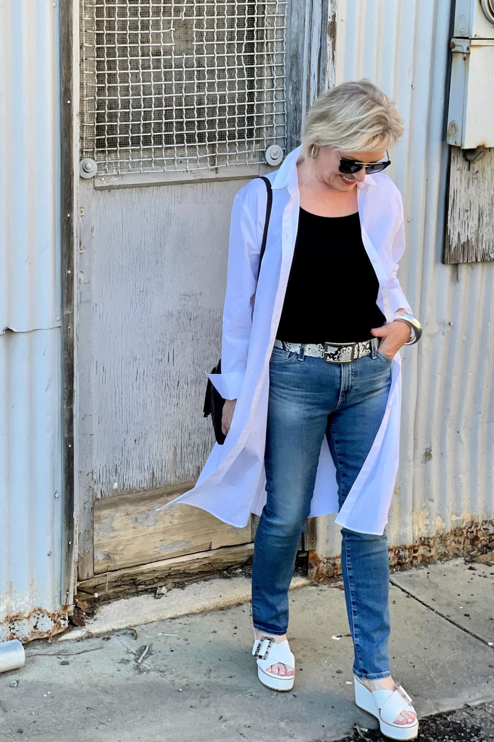 blonde woman wearing white dress shirtdress as a duster