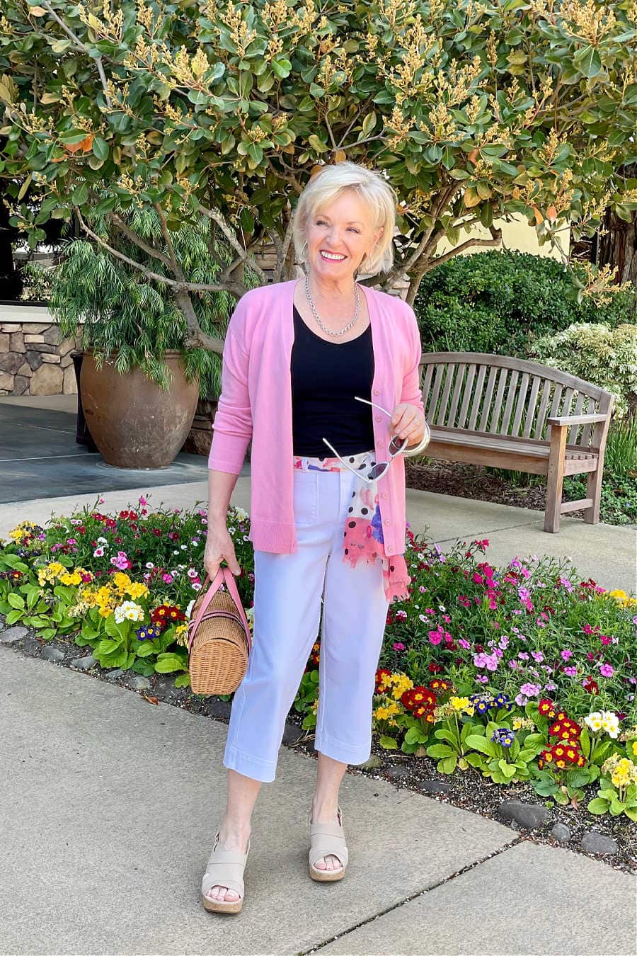 jennifer from a well styled life wearing Talbots pink sweater and white crops