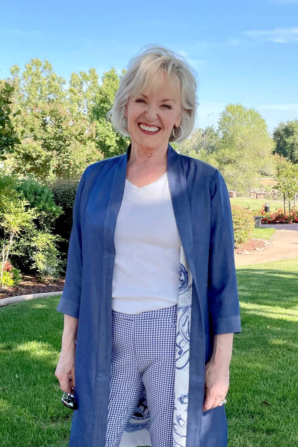 woman wearing white tee, blue kimono and plaid pants