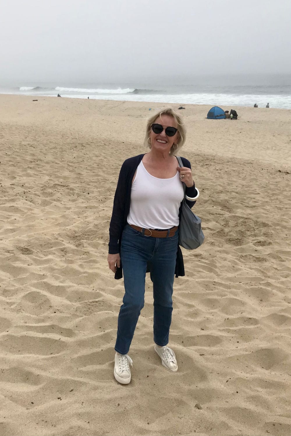 woman standing on beach at half moon bay